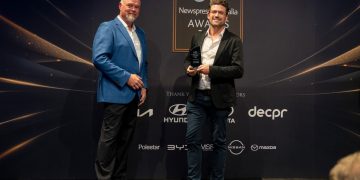 Andrew van Leeuwen (right) accepting the Best Podcast award in Sydney. Image: Newspress Australia
