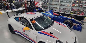 Harry Walker's Porsche next to the iconic BAR F1 car owned by his father Campbell. Image: Supplied